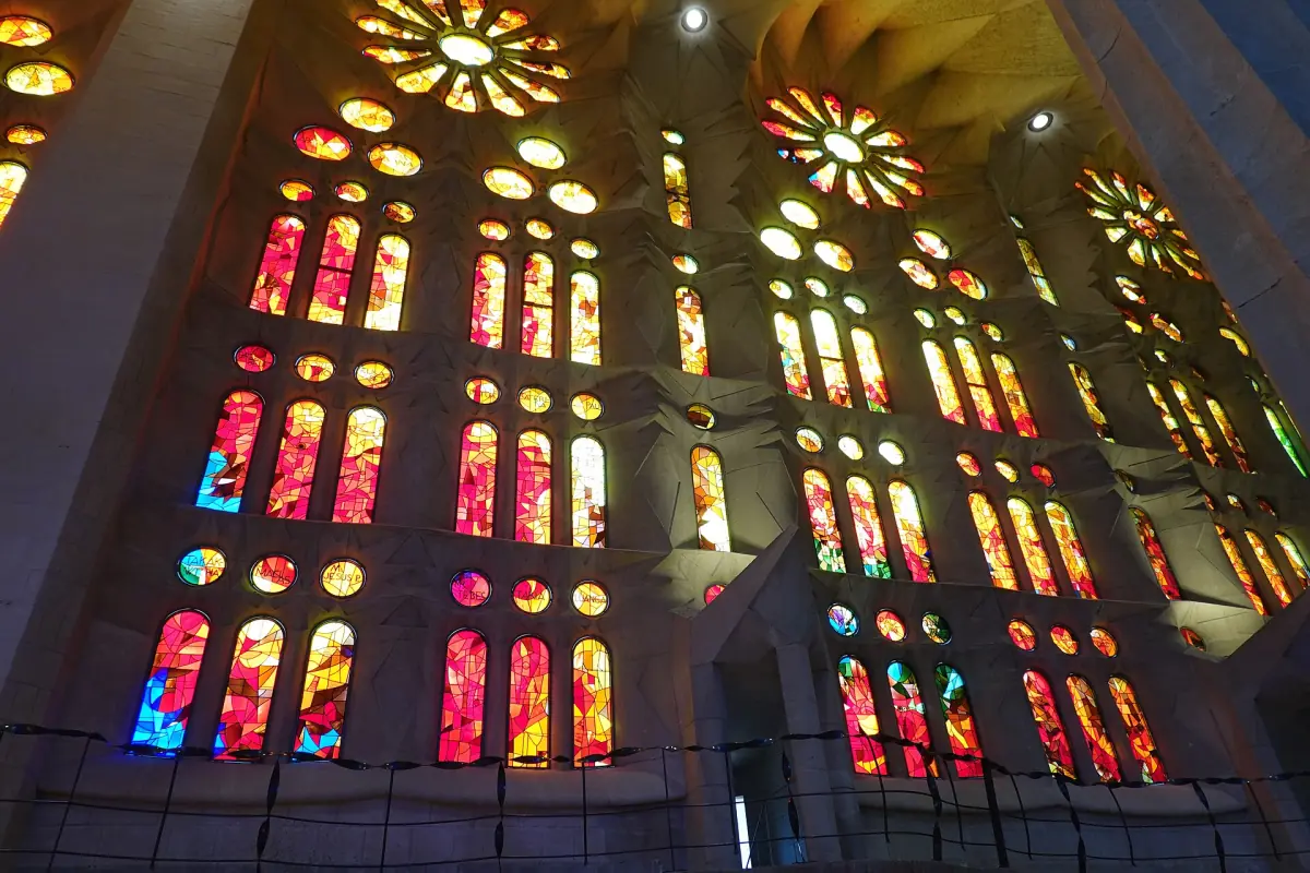 Red and orange stained-glass windows inside the Sagrada Família